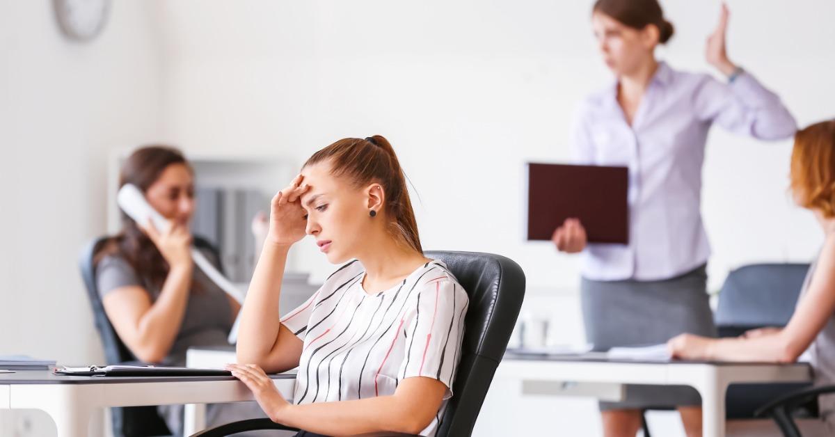 female employee stressed