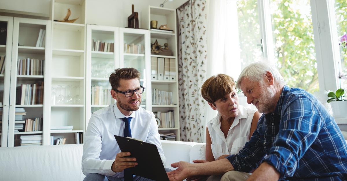 senior couple planning their investments with financial advisor
