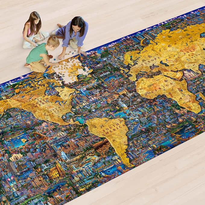 Kids and adult doing The World’s Largest Puzzle by Dowdle map of the world