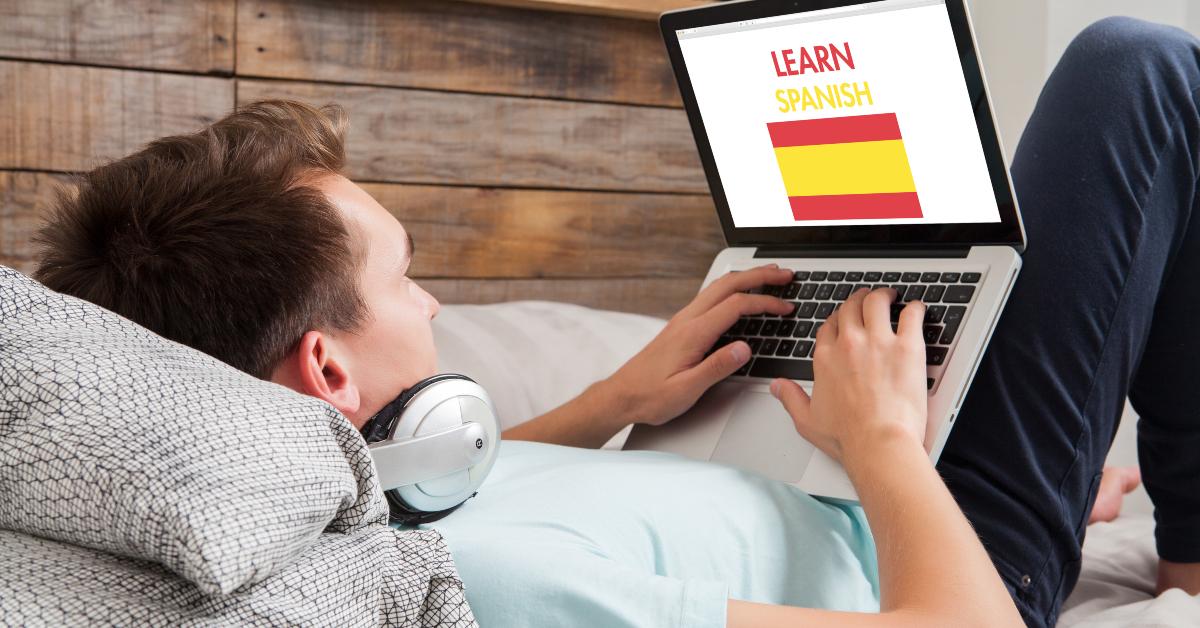 man learning spanish at home