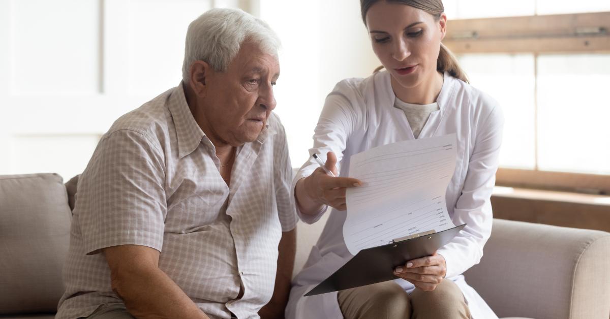 medical worker visit old retired male patient