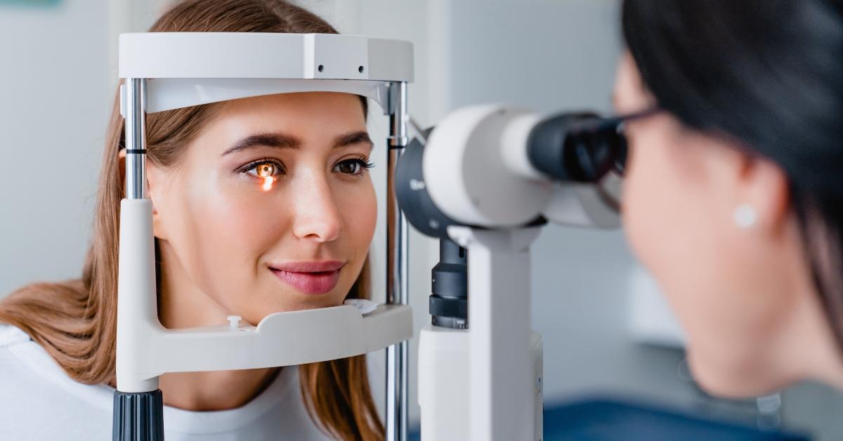 eye doctor with female patient during an examination in modern clinic