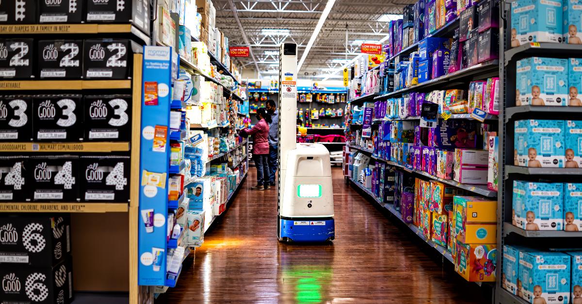 Walmart products goods aisle and robot checking inventory