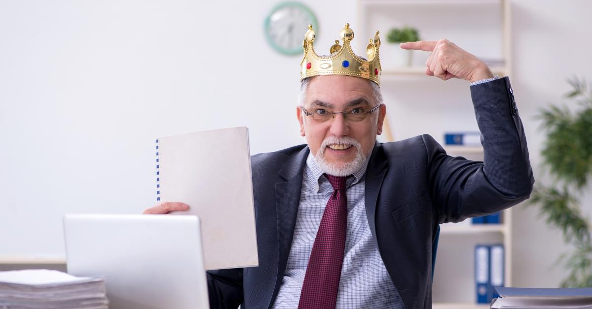 senior employee at work wearing a crown