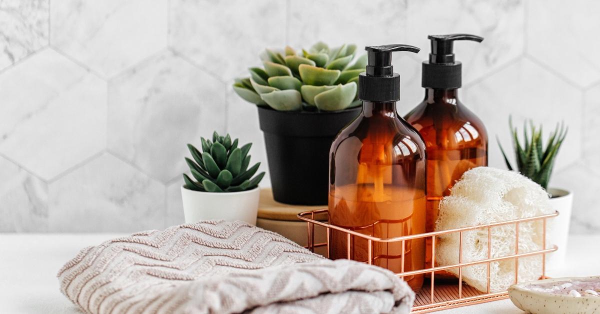 soap and shampoo bottles and cotton towels