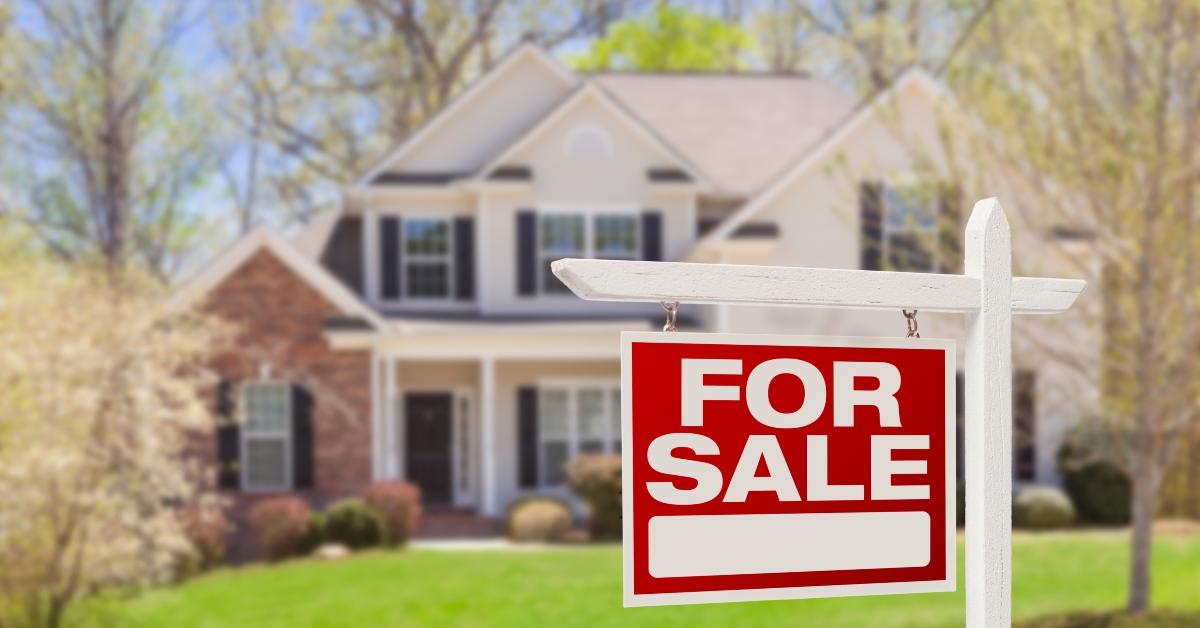 home for sale real estate sign and house