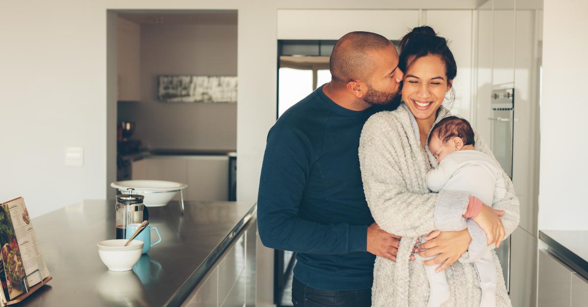 young family of three in kitchen