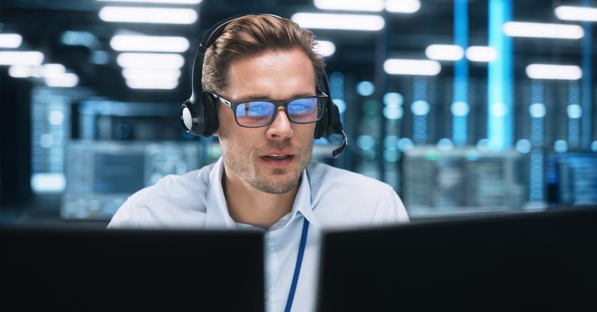 male call centre worker wearing a phone headset