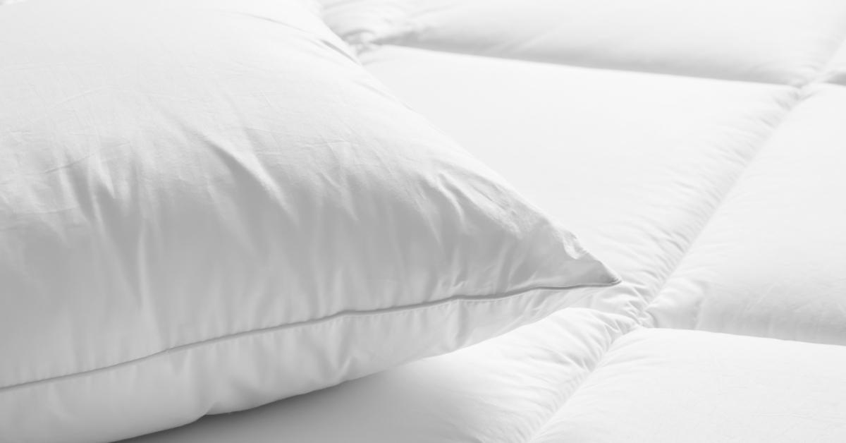 white pillow on the bed in the bedroom