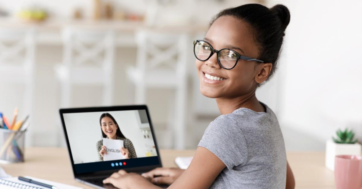 student in glasses studying at home online