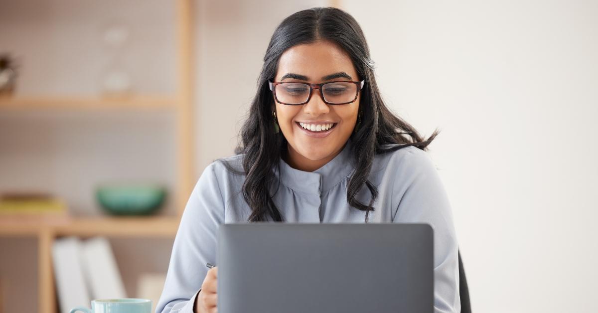 businesswoman with a laptop searching for a website
