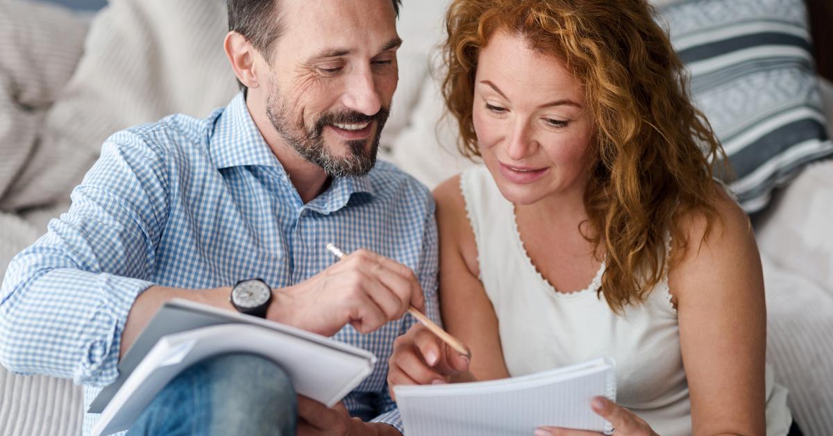 middle-aged couple making notes
