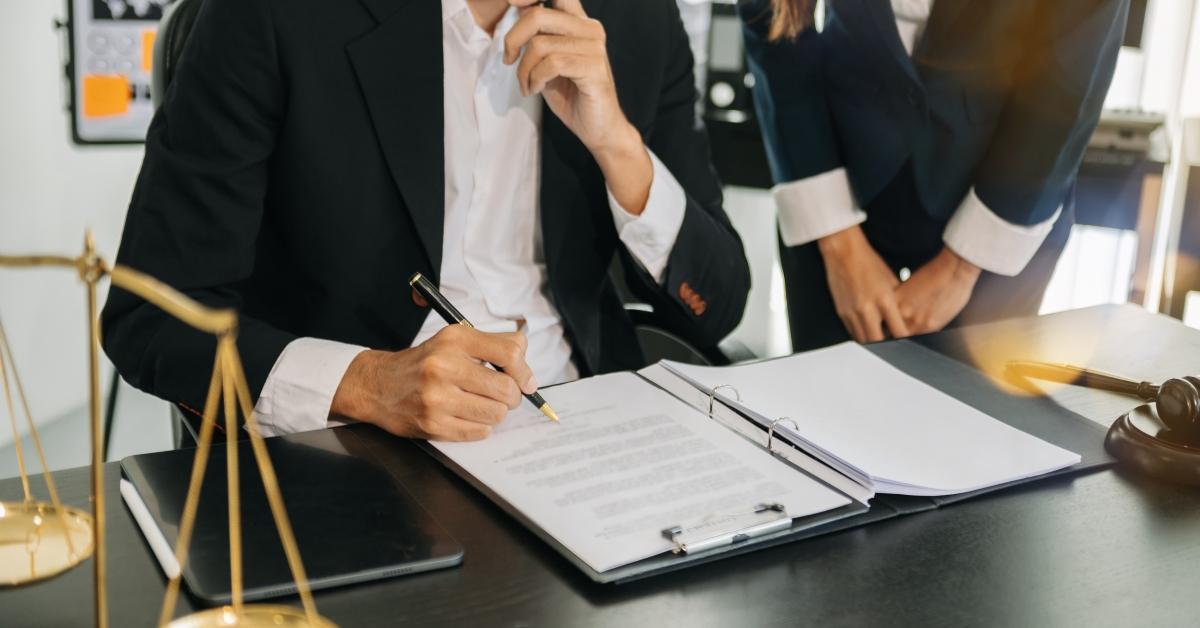 lawyers discussing contract papers