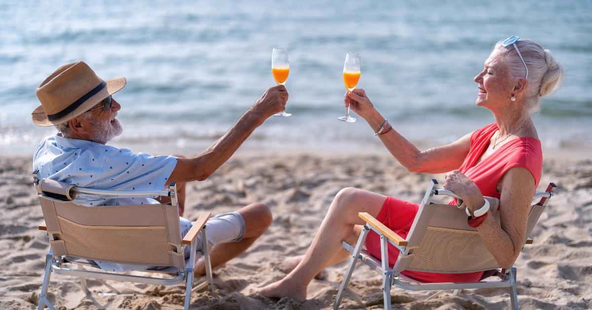 mature people on the sand at the beach