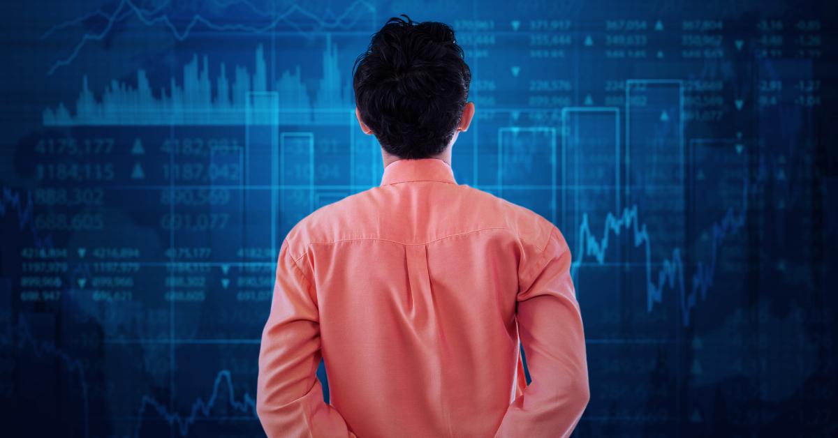 worker watching at stock exchange graph
