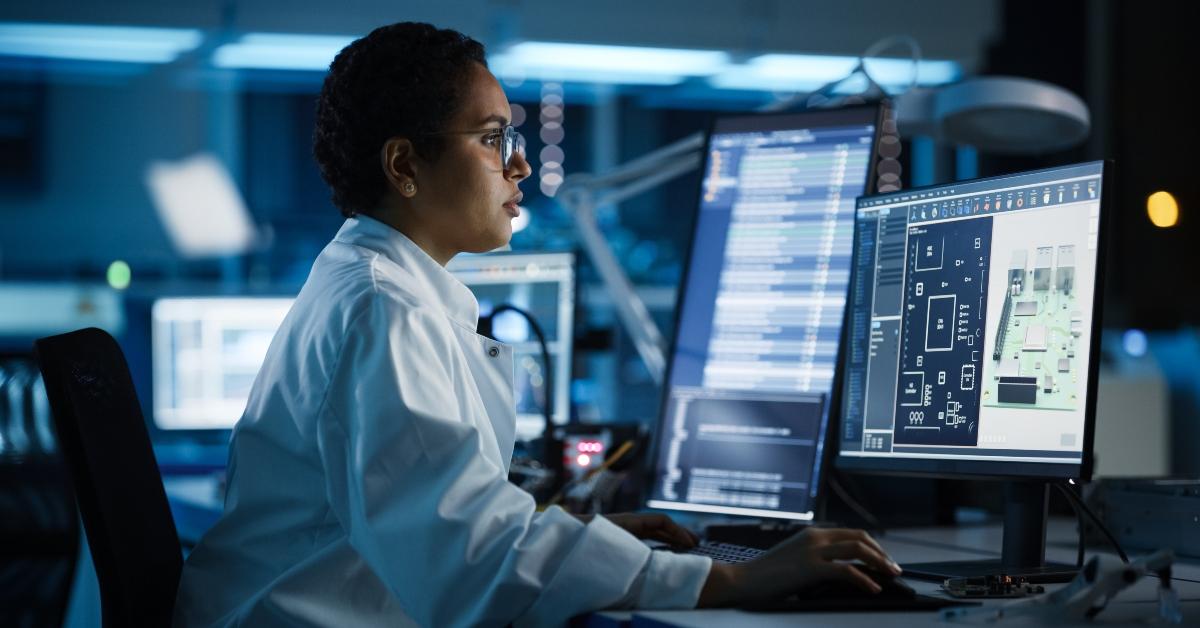engineer works on computer with cad software