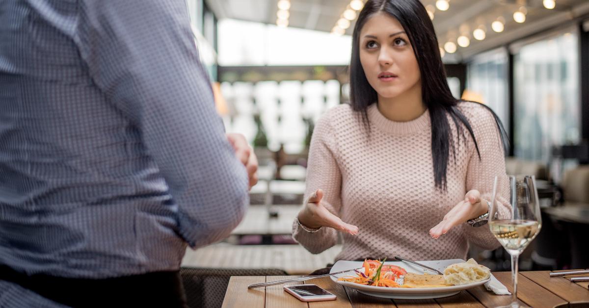 woman complaining about food quality and taste in restaurant