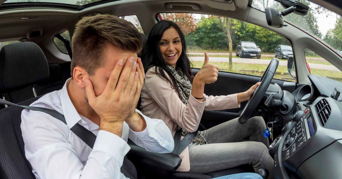 couple is driving in a car