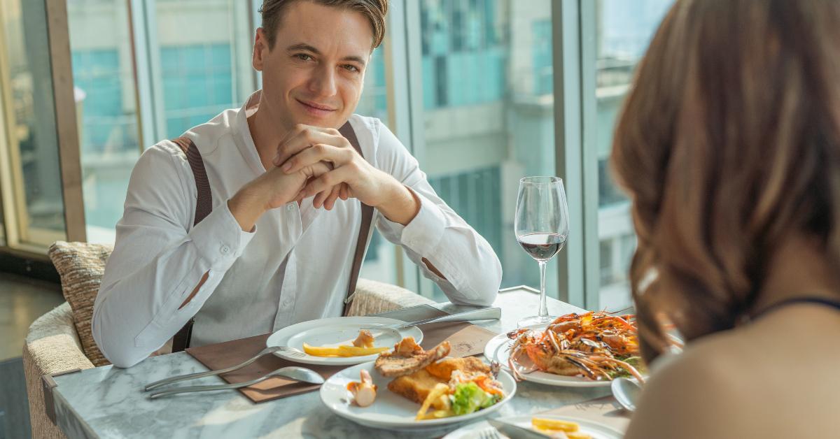 couple eating lunch in a rooftop restaurant