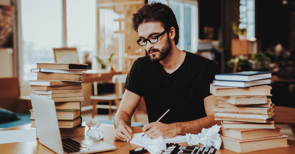 pensive freelance text writer working at desk 