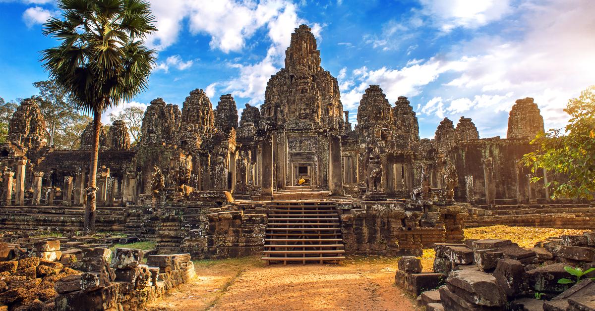 ancient stone faces at sunset of Bayon temple
