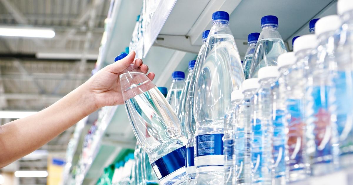 drinking water in hand at shop