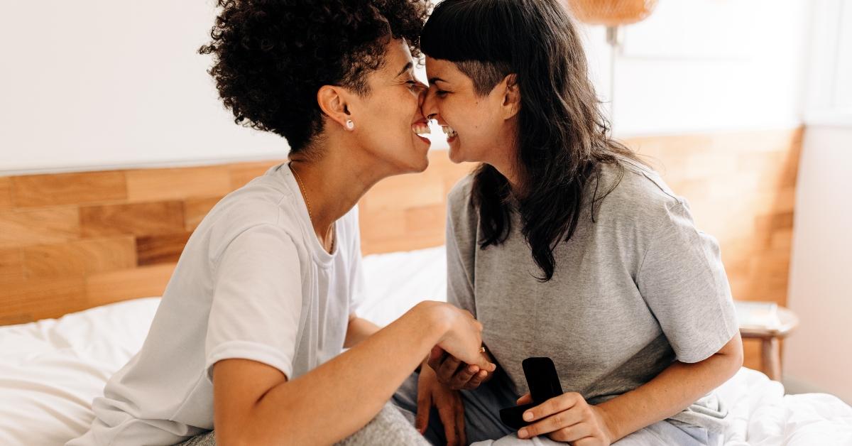queer couple celebrating their engagement at home