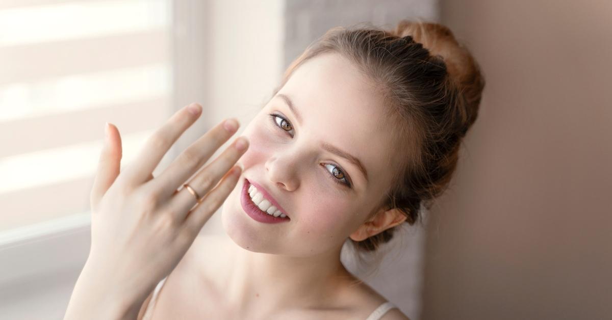 young woman showing wedding ring on her finger