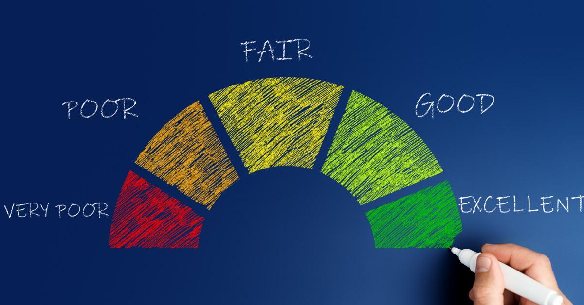 hand using marker to draw colorful credit score graph on blue board