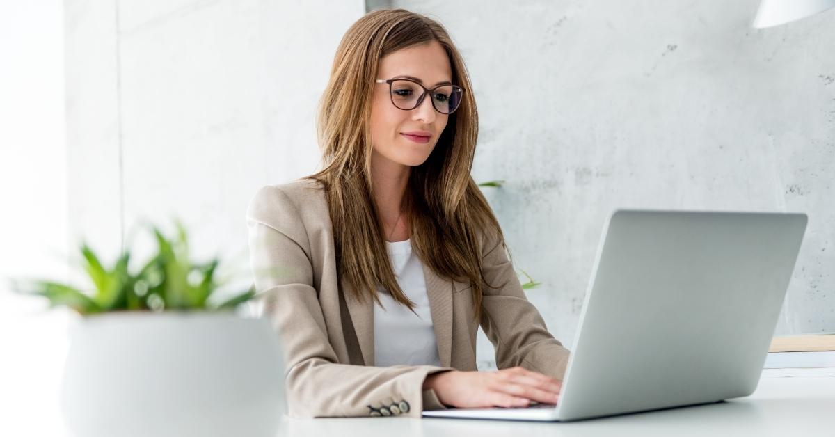 beautiful businesswoman typing on laptop