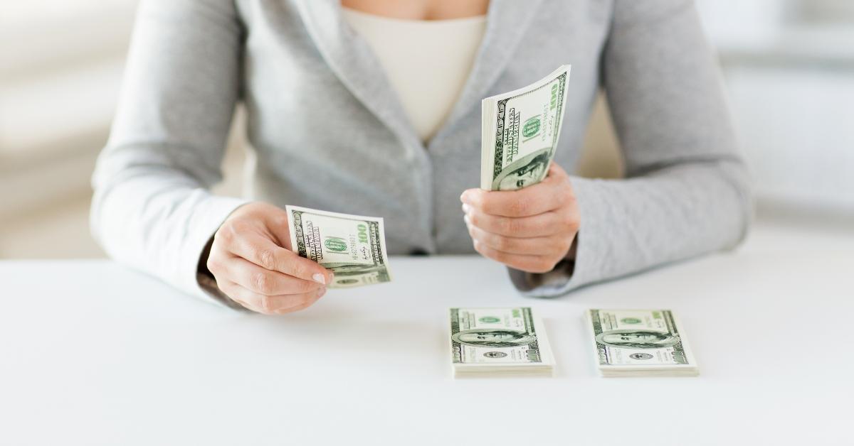 woman hands counting us dollar money