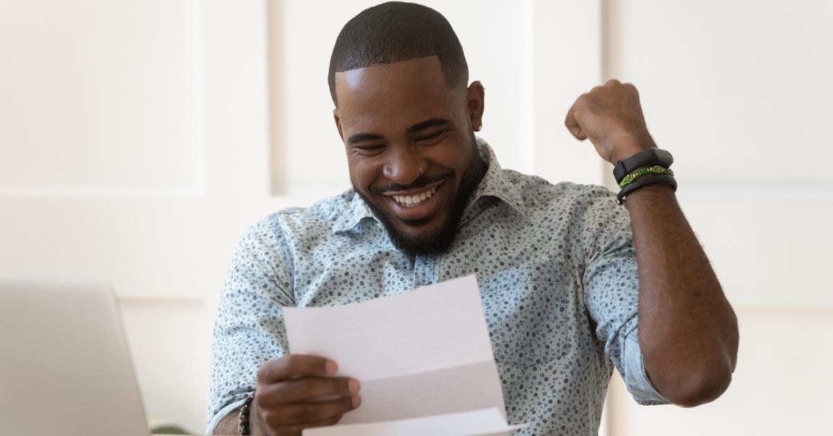 happy african american guy received banking loan approval