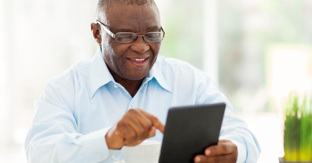 senior african american man using tablet computer at home 