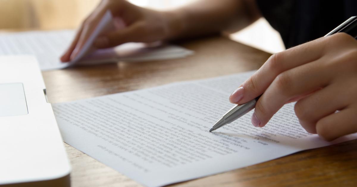 hand with pen proofreading 