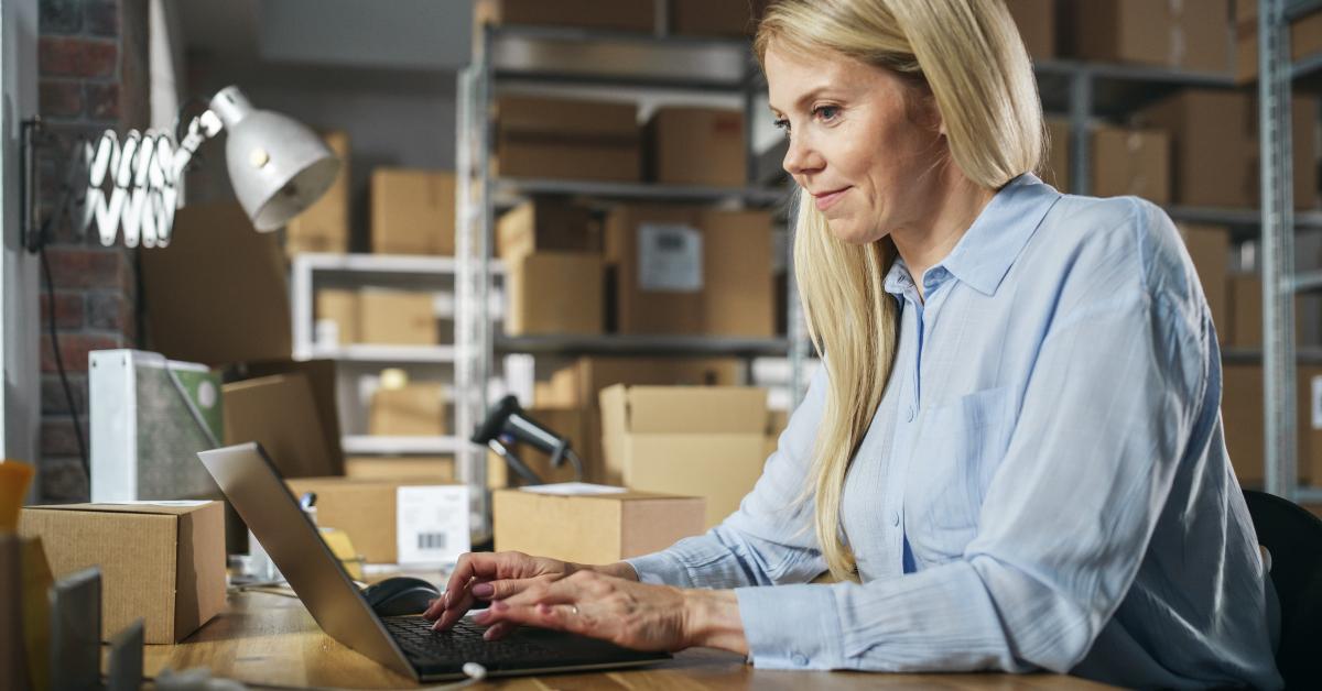 happy customer support manager using laptop