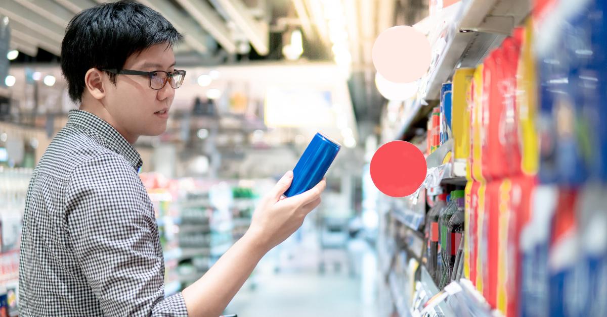 asian man shopper choosing fizzy drink