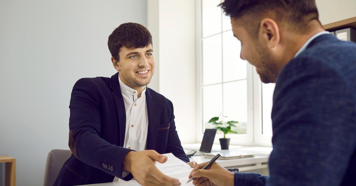 two people meet in the office and sign a business contract