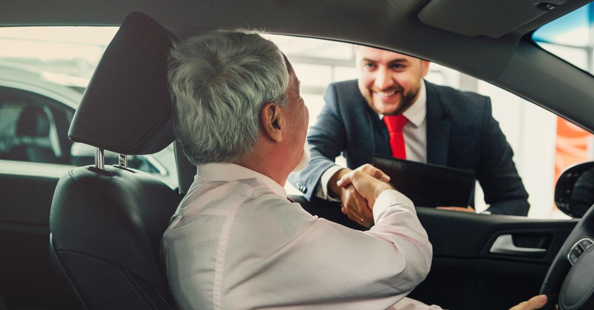 aged man buy car with dealer