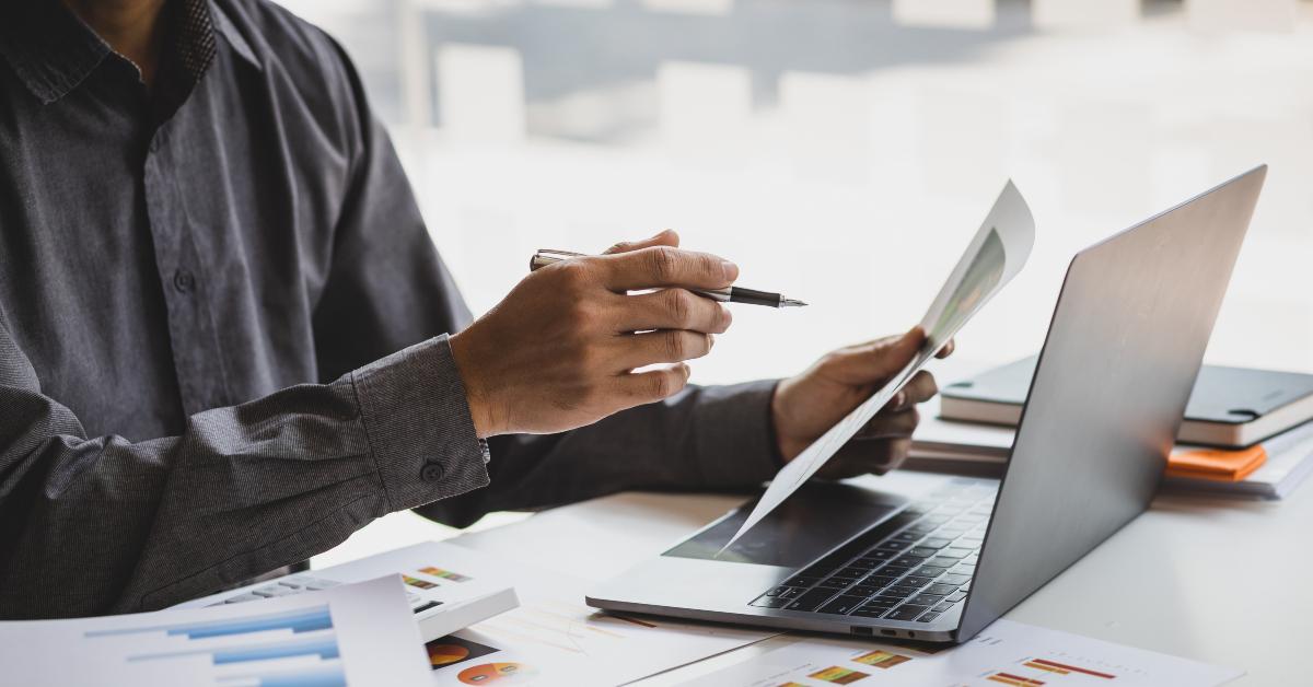 businessman working with business report papers on office desk