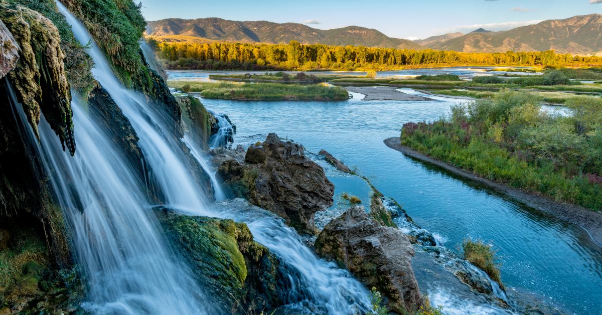 small water fall flows into the Snake River in Idaho