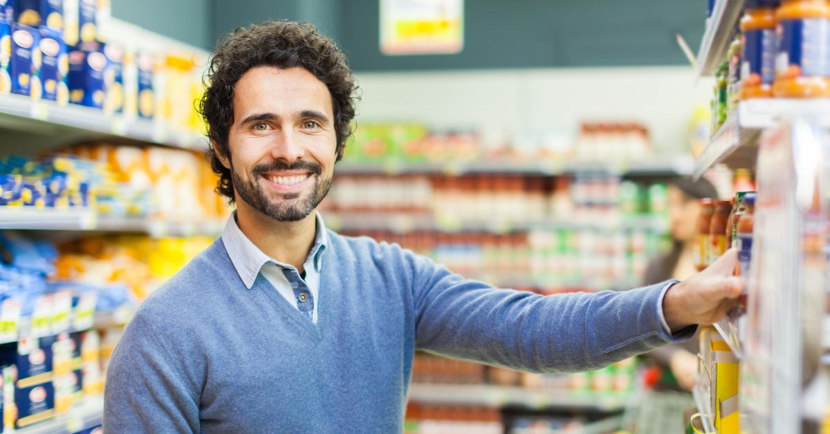 handsome man shopping in a supermarket