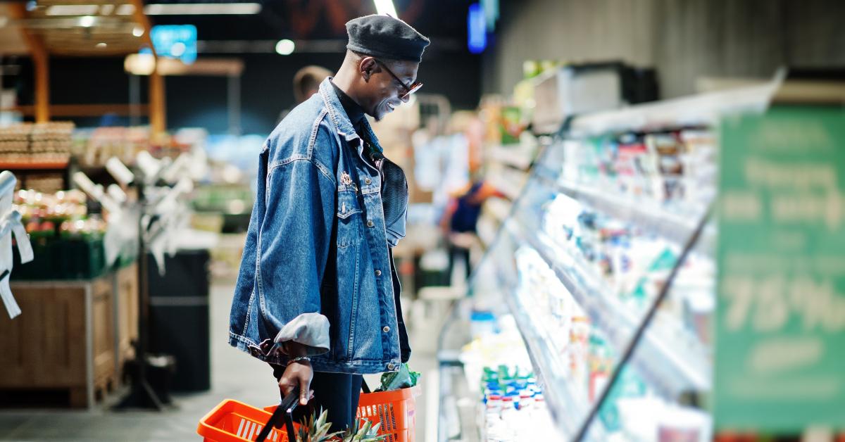 man at jeans jacket and black beret