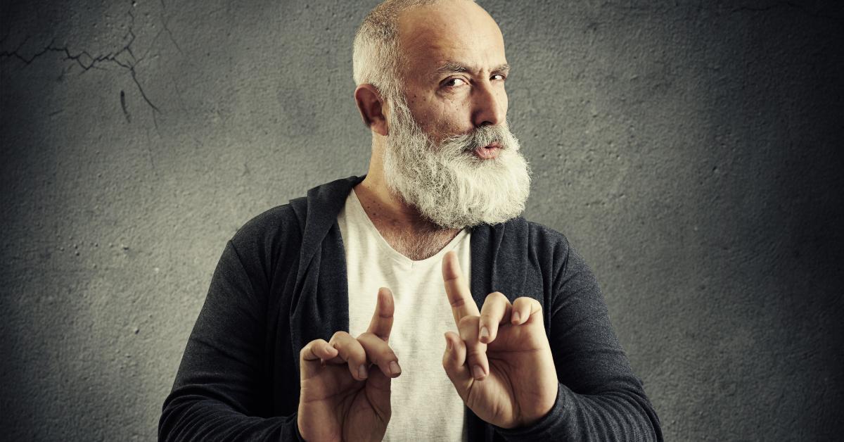 senior bearded man showing refusal sign