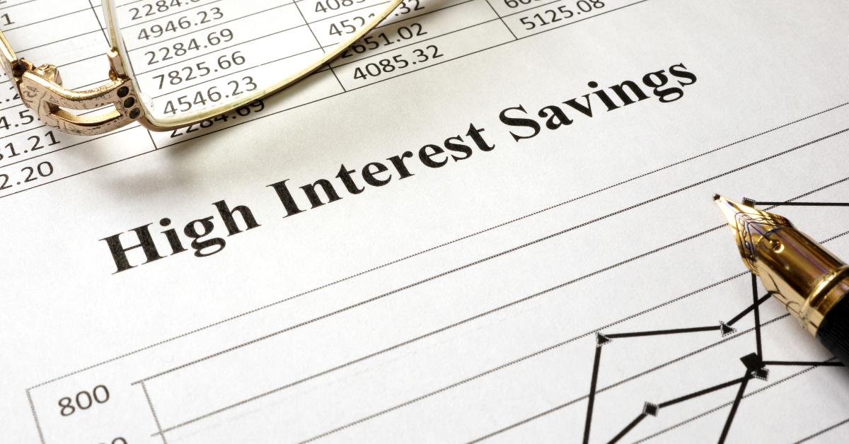 sign high interest savings on a paper and glasses