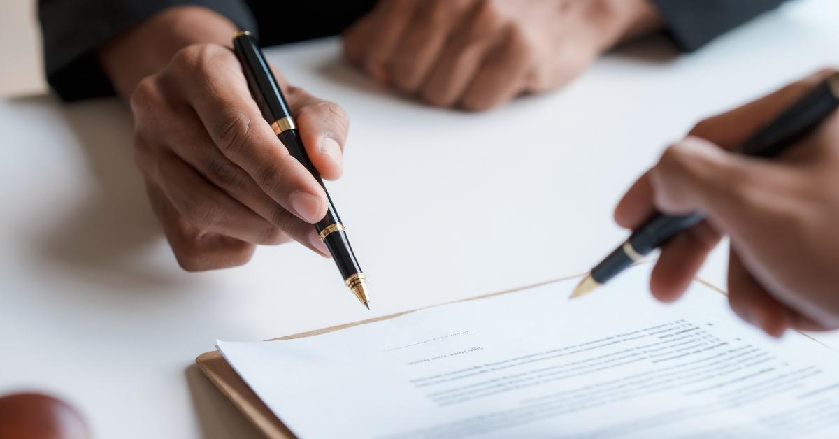 lawyer and client signing