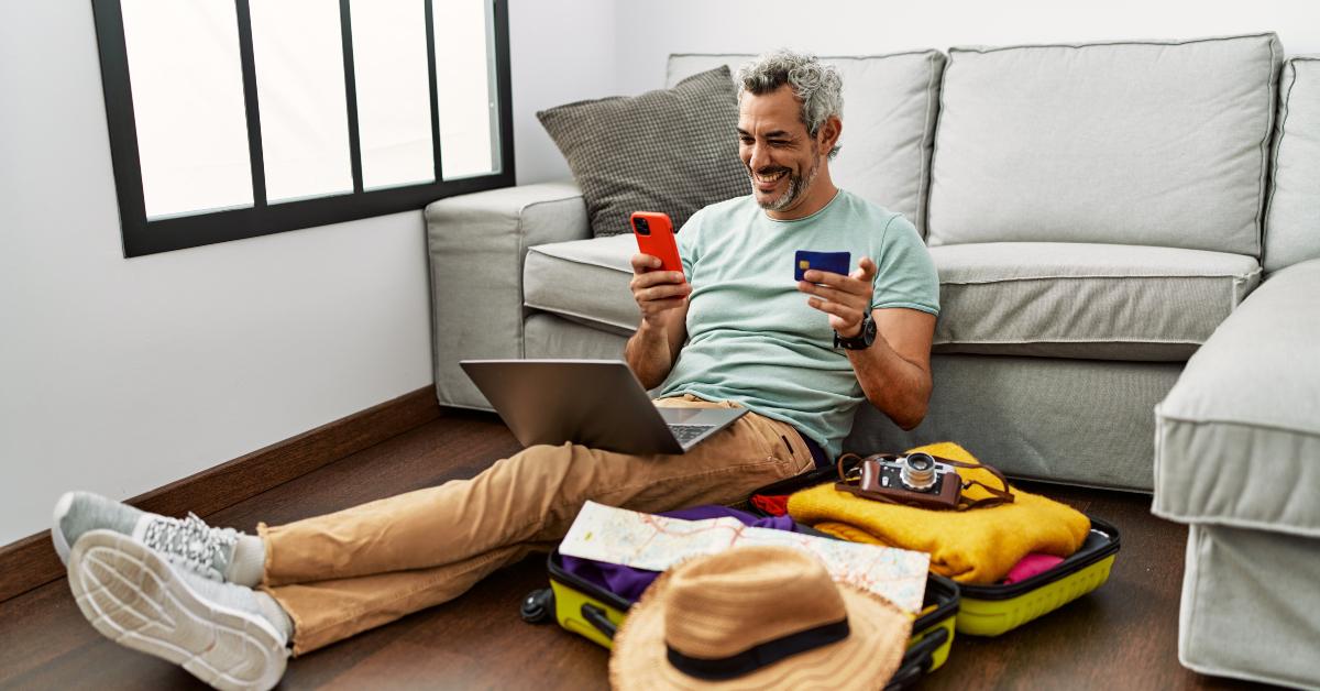 grey-haired man using smartphone
