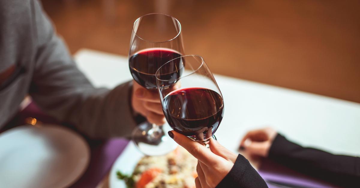 couple with glasses of red wine