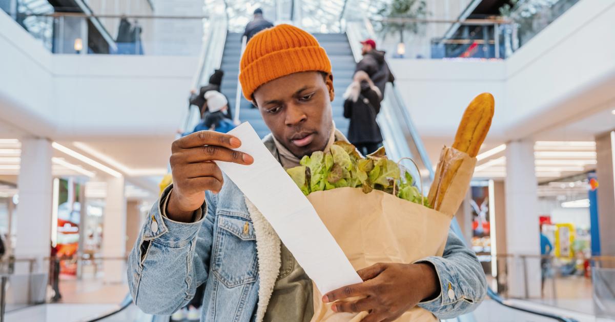 Man looks at receipt