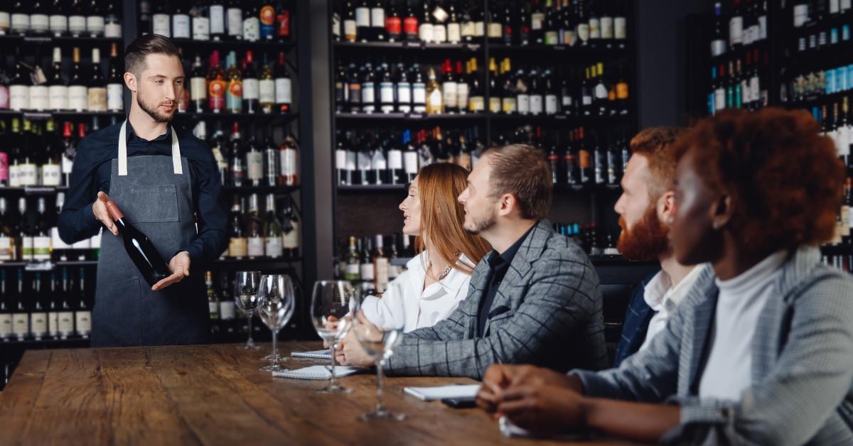 Wine expert discussing bottle