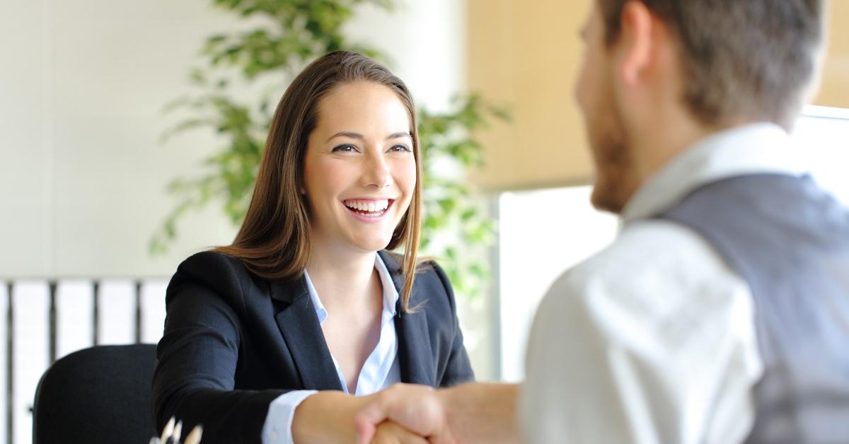 Female worker shaking hands